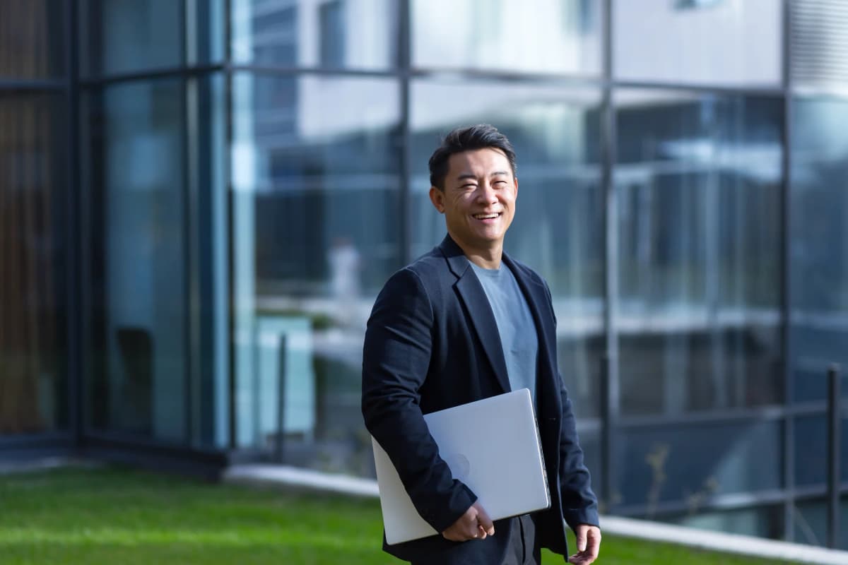 Person with laptop outdoors